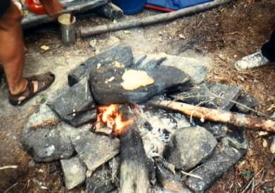 Cooking pancakes on rock in LaVerendrye Provincial Park, PQ